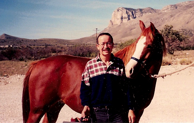 Erick in October, 1994, grooming Lady prior to riding at Guadalupe Peak