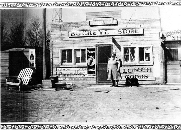 Iva Hazel Henry Conard Delaney Doyle standing in front of Buckeye Store